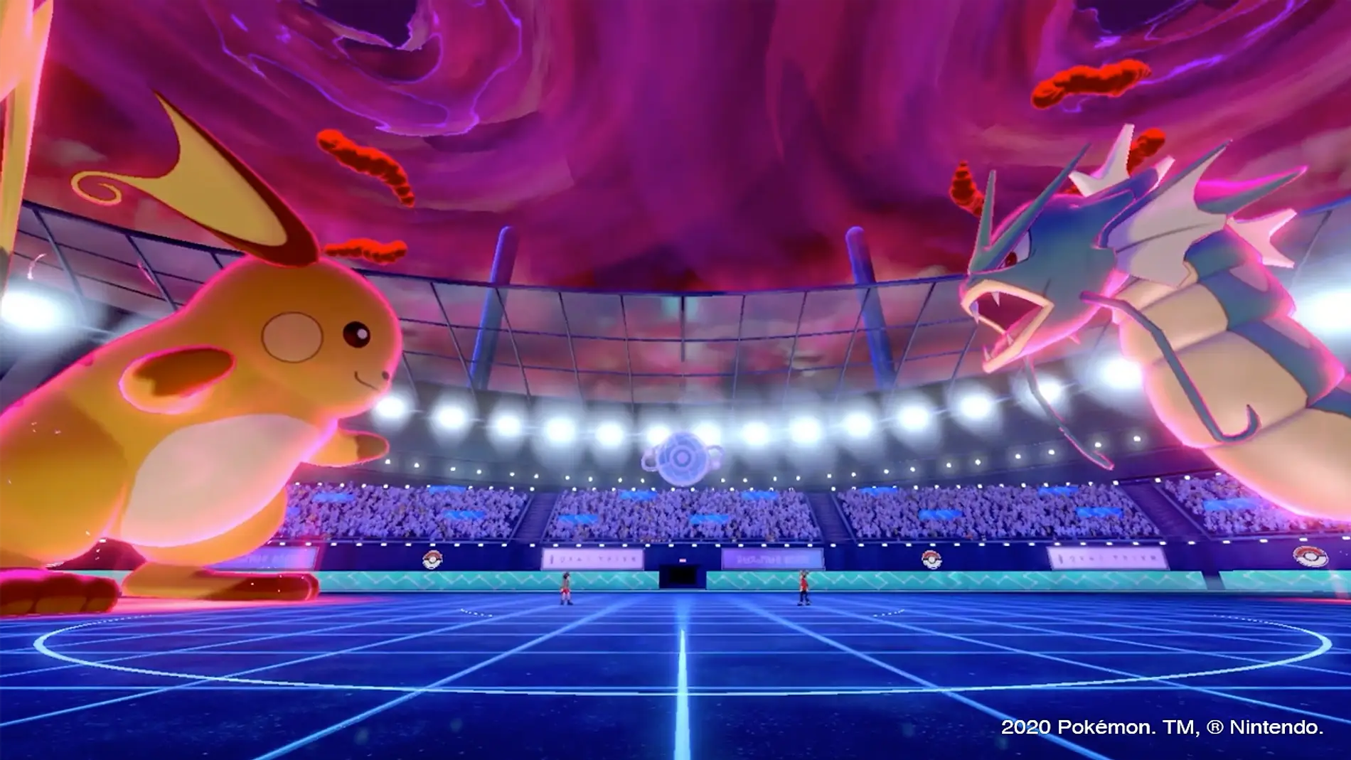 Pokémon gigantes frente a frente num estádio lotado